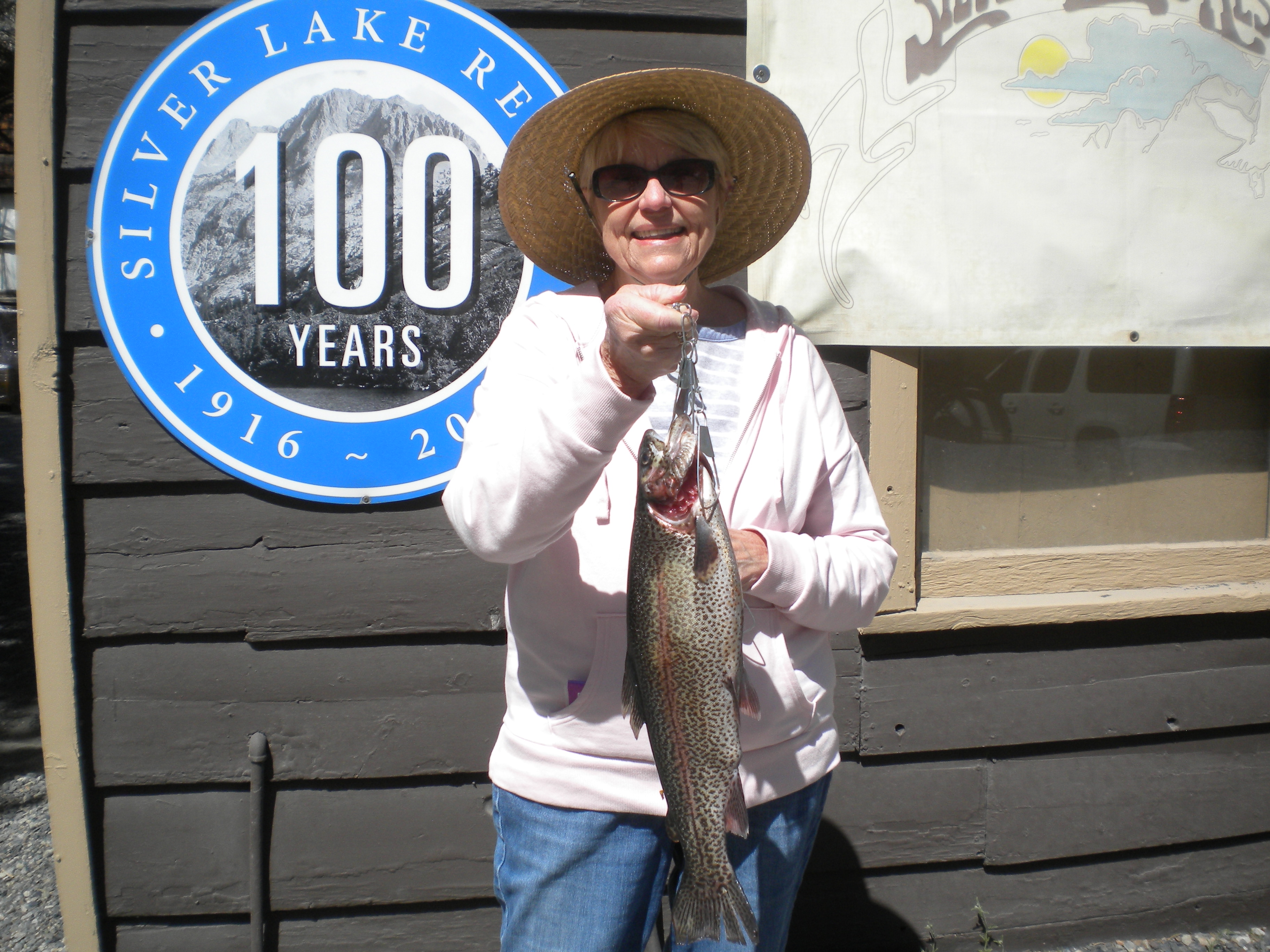 Donna Kline hooked into this nice 2 pound 8oz Rainbow fishing from a boat on Silver Lake using a Olive Wooly Bugger